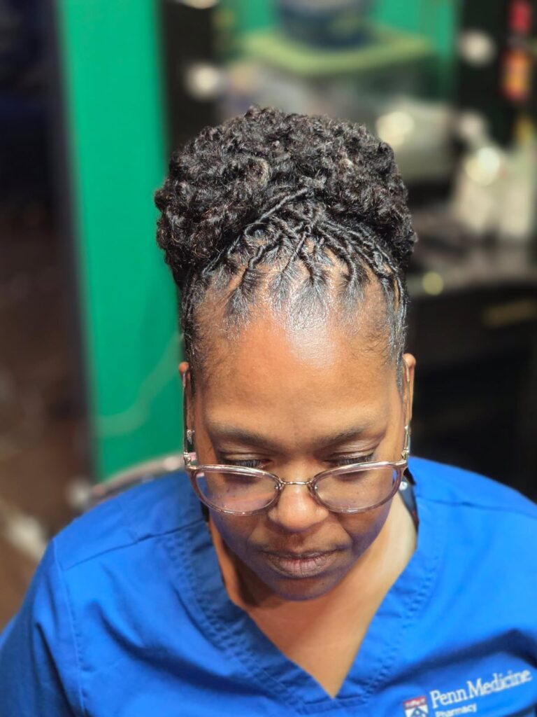 Women with styled locs.