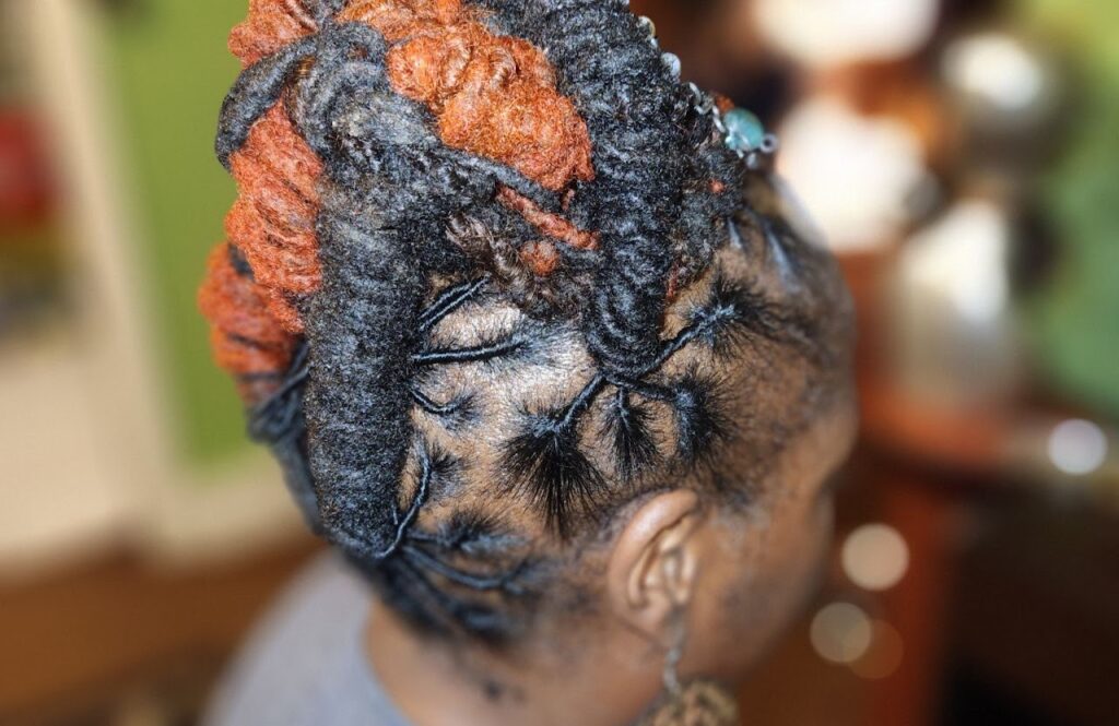 Loc Maintenance Photo - Woman with styled locs.