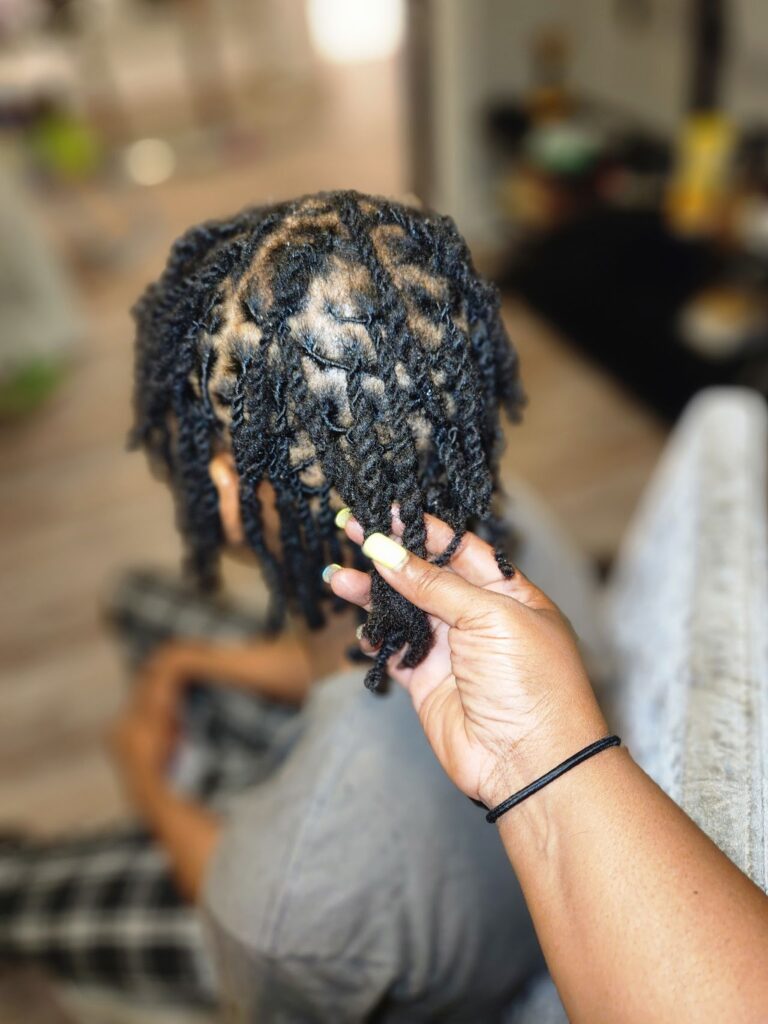 The after photo of before and after loc photos: Photo of a person's hair done neatly